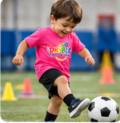 Boy kicking football at Tiny DRIBLRS